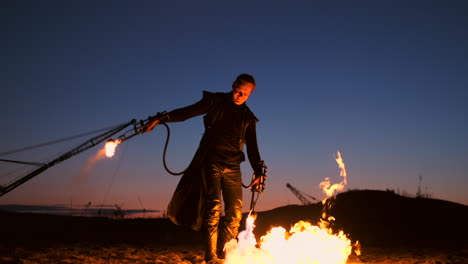 A-man-with-a-flamethrower-at-sunset-in-slow-motion.-Costume-for-zombie-Apocalypse-and-Halloween